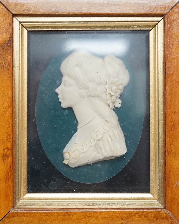 Attributed to Leslie Ray (20th century), a pair of maple framed wax reliefs, a lady and a gentleman in naval uniform, 21.5 x 19cm total. Condition - good